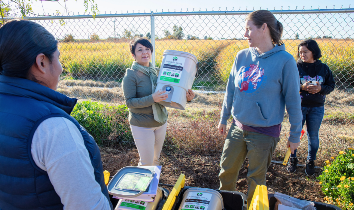 Nayamin Showing A Kitchen Composter